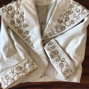 Leather jacket with sequins and pearls